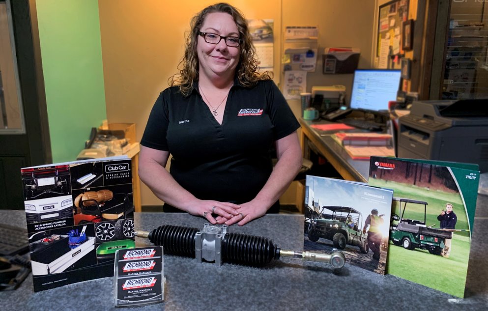 Martha Martinez, parts department staff, at Specialty Car Co. desk.